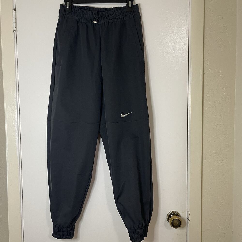 NIKE Woven black tapered joggers swoosh detail size US small